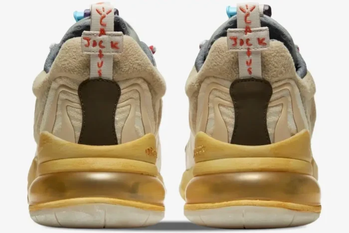 Heel view of Nike Air Max 270 React Travis Scott Cactus Trails sneakers with cream and yellow accents. - SKU DD8798-200