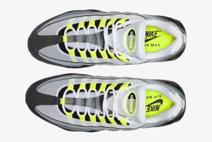 Top-down view of Nike Air Max 95 OG Neon Grey Black sneakers with volt yellow lace loops. - SKU 554970-071