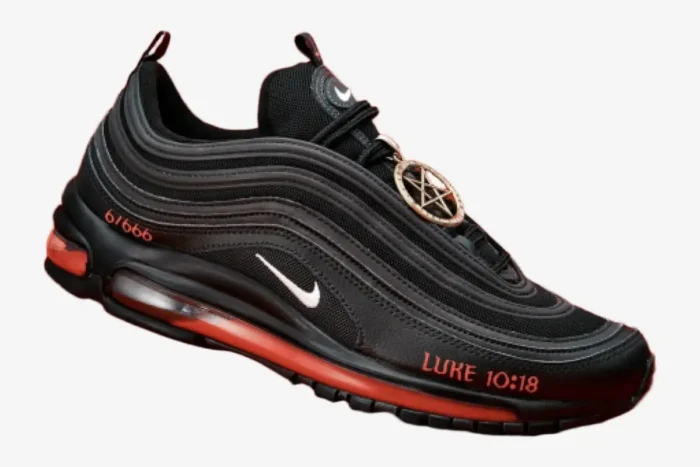 Side profile of a black Nike Air Max 97 Satan Shoe custom with red liquid soles and a pentagram charm.