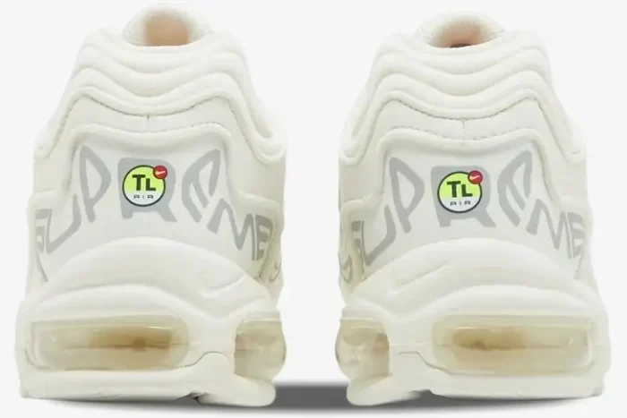 Rear view of white Nike Air Max 98 TL x Supreme sneakers featuring bold Supreme branding and TL Air logo on the heels. - SKU DR1033-100