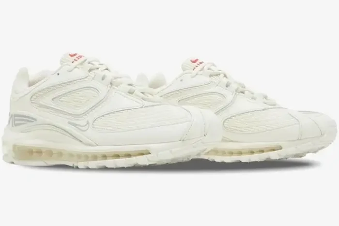 Side profile of Nike Air Max 98 TL x Supreme White sneakers featuring a cream mesh and leather upper. - SKU DR1033-100