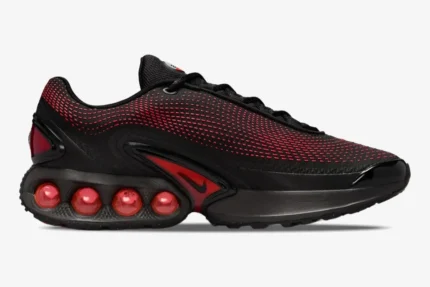 Side profile of the Nike Air Max DN Bred sneaker in black and university red with visible air bubbles. - SKU HV5235-002