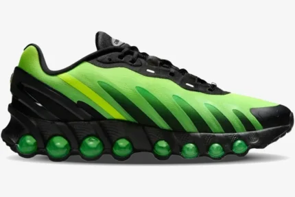 Side view of Nike Air Max DN8 sneaker in Black Green Strike Volt with visible green air units. - SKU HQ4681-010