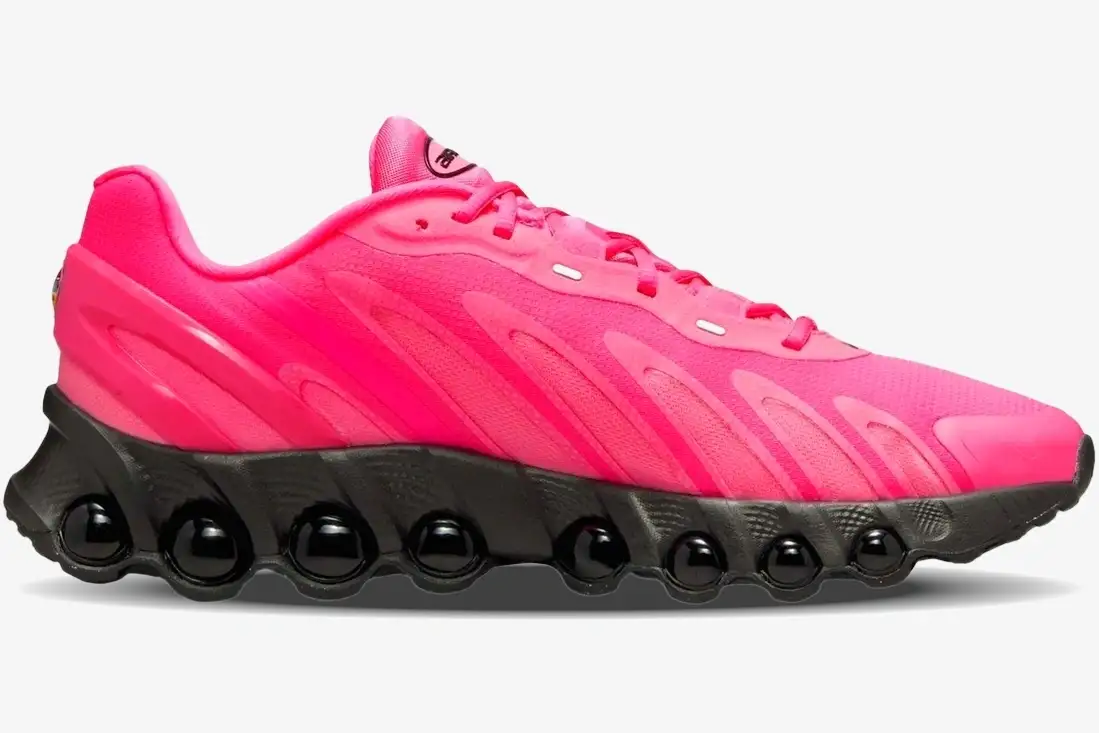 nike-air-max-dn8-hyper-pink-black-side-view-fq7860-600-20260107_184426 Side profile of Nike Air Max Dn8 sneakers in Hyper Pink with a black chunky sole and visible air units. - SKU FQ7860-600
