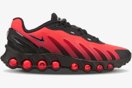Side profile of Nike Air Max DN8 sneakers in a red and black gradient colorway with visible red air units. - SKU FQ7860-008