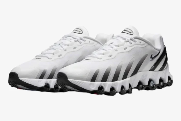 Nike Air Max DN8 sneakers in white and black, shown from a three-quarter front perspective. - SKU  FQ7860-100