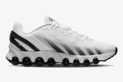 White and black Nike Air Max DN8 sneaker shown from a side profile view with black air units. - SKU  FQ7860-100