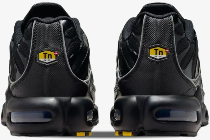 Rear view of Nike Air Max Plus Black Reflective sneakers showing the Tn Air heel logo. - SKU 604133-050