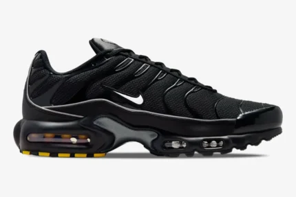 Side profile of Nike Air Max Plus Black Reflective sneakers featuring a black mesh upper and white swoosh. - SKU 604133-050