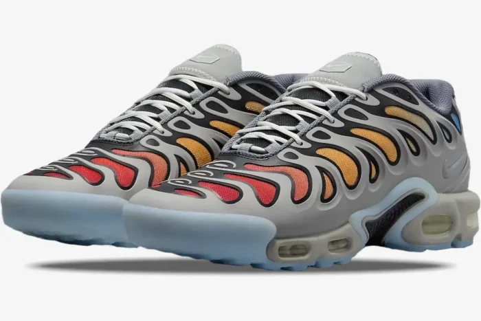 Nike Air Max Plus Drift sneakers in Smoke Grey Orange, three-quarter front view showing gradient mesh and grey cage. - SKU FD4290-002