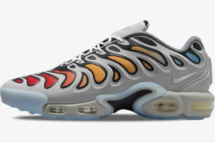Side profile of Nike Air Max Plus Drift sneakers in Smoke Grey with orange and red gradient mesh details. - SKU FD4290-002