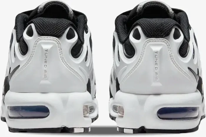 Rear view of Nike Air Max Plus Drift sneakers in white and black, showing the Tuned Air heel branding. - SKU FV4081-102