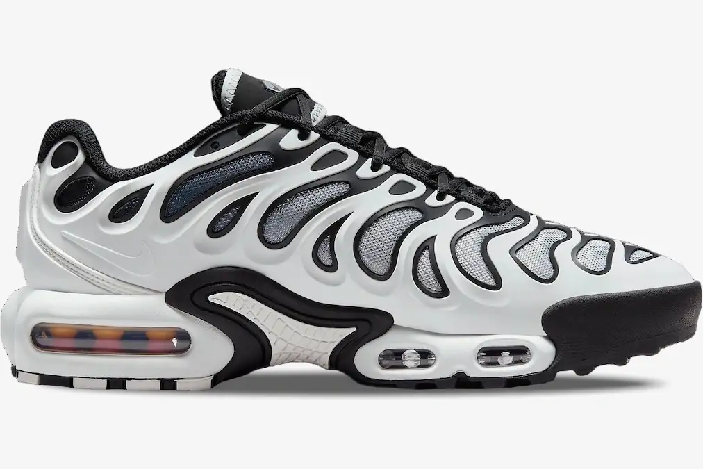 nike-air-max-plus-drift-white-black-side-view-fv4081-102-857-190 Nike Air Max Plus Drift sneaker in white and black, side profile view with visible air cushioning. - SKU FV4081-102