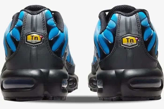 Rear view of Nike Air Max Plus Gradient Blue White sneakers showing the black heel and yellow Tn Air logo. - SKU FQ0204-010
