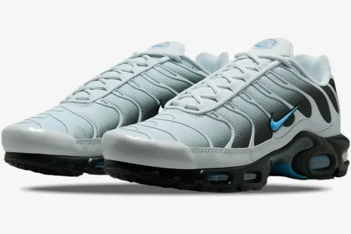 Nike Air Max Plus sneakers in Grey and University Blue, three-quarter front view showing the gradient upper. - SKU DM0032-015