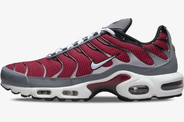 Side profile of a Nike Air Max Plus sneaker in red, grey, and white with visible Air units. - SKU DQ3983-600