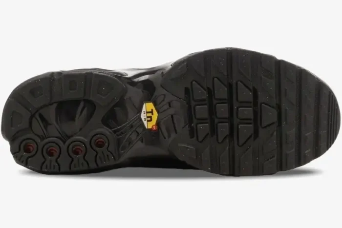 Bottom view of the black Nike Air Max Plus Tiempo hybrid outsole featuring the yellow Tn Air logo. - SKU HF0074-001