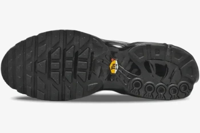 Bottom sole view of the black Nike Air Max Plus Tiempo sneaker with yellow Tn Air logo. - SKU HM6850-001
