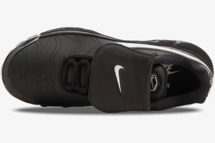 Top view of Nike Air Max Plus Tiempo hybrid in black leather with a large fold-over tongue and white swoosh. - SKU HF0074-001