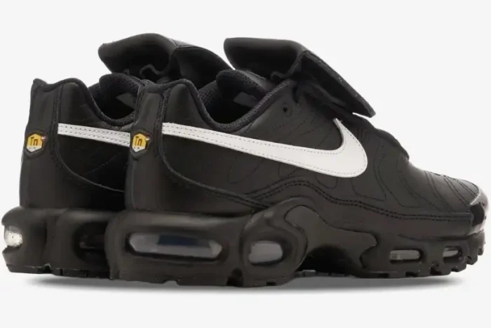 Rear view of Nike Air Max Plus Tiempo hybrid sneakers in black leather with a white swoosh. - SKU HF0074-001