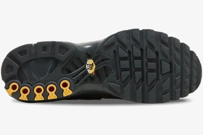 Outsole view of Nike Air Max Plus TN Black Gold Snakeskin showing tread and yellow Tn Air logo. - SKU BQ3169-002