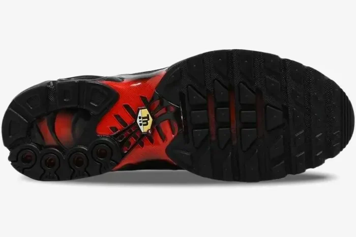 Bottom view of Nike Air Max Plus TN Deadpool sneakers showing black and red rubber outsole. - SKU DC1936-001