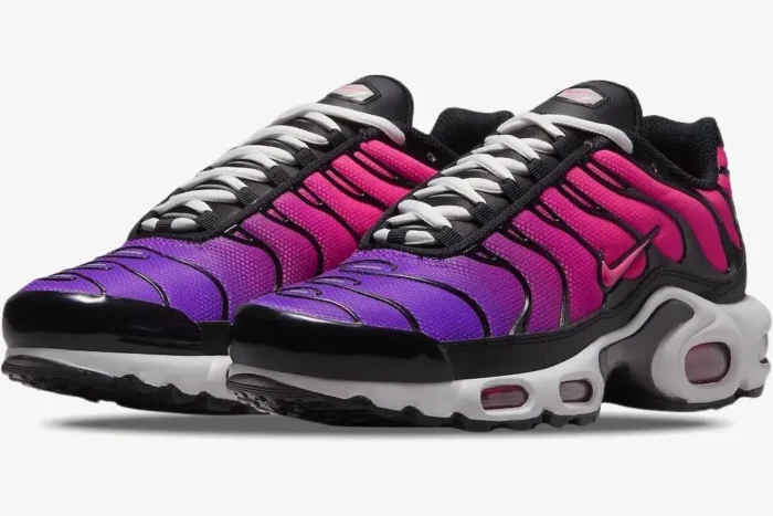Nike Air Max Plus TN Dusk sneakers with purple to pink gradient and black overlays, three-quarter front view. - SKU DZ3670-500