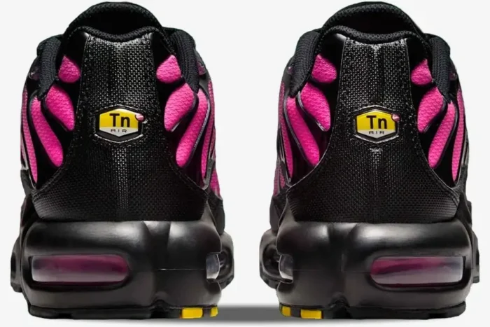 Rear view of Nike Air Max Plus TN sneakers in pink and black gradient with yellow Tn logo. - SKU DM0032-020