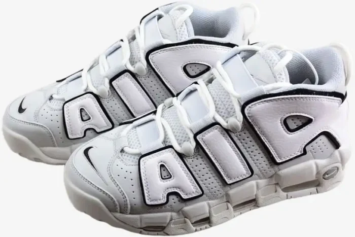 Nike Air More Uptempo '96 Photon Dust sneakers, three-quarter view, white leather with black outlined 'AIR' branding. - SKU FB3021-001