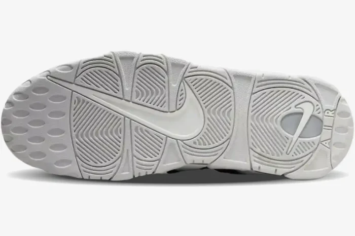 Bottom view of the Nike Air More Uptempo '96 Photon Dust outsole with textured grip and Swoosh logos. - SKU FB3021-001