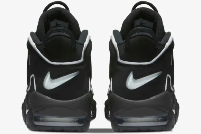 Rear view of Nike Air More Uptempo Black White OG sneakers featuring white heel swooshes and black pull tabs. - SKU 414962-002