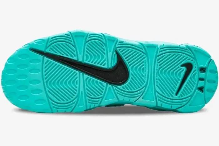 Bottom view of a Nike Air More Uptempo Light Aqua sneaker showing the teal rubber outsole and black swoosh logo. - SKU AA1554-403
