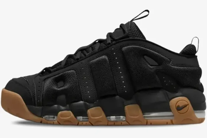 Side profile of Nike Air More Uptempo Low sneakers in black with a gum rubber sole. - SKU FZ3055003
