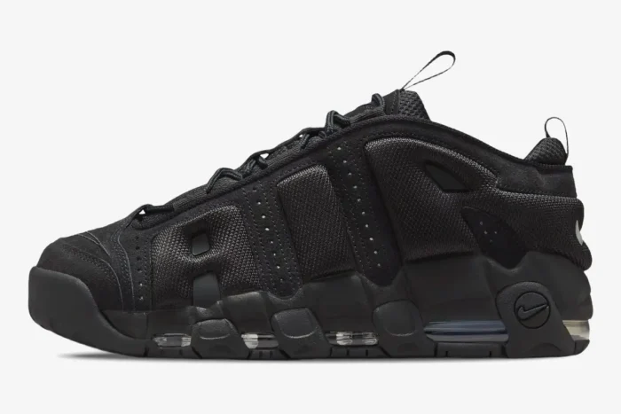 Side view of Nike Air More Uptempo Low sneakers in triple black with visible Air cushioning. - SKU IM6649-001