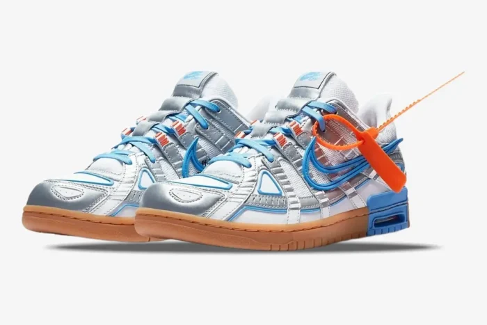 Nike Air Rubber Dunk x Off-White University Blue sneakers, front three-quarter view on white background. - SKU CU6015-100