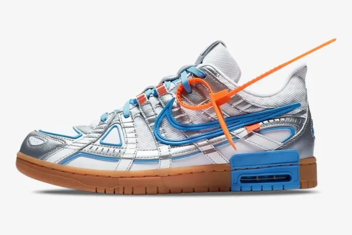 Nike Air Rubber Dunk x Off-White University Blue sneaker in a side profile view with metallic silver and blue details. - SKU CU6015-100
