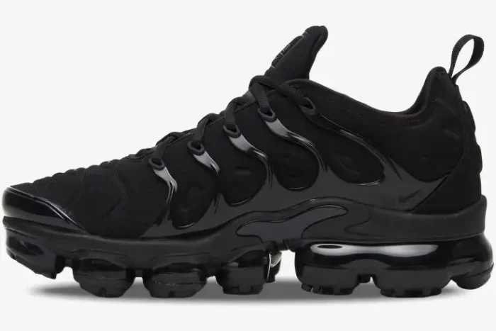 Nike Air Vapormax Plus Triple Black sneakers shown from a side profile perspective. - SKU 924453-004