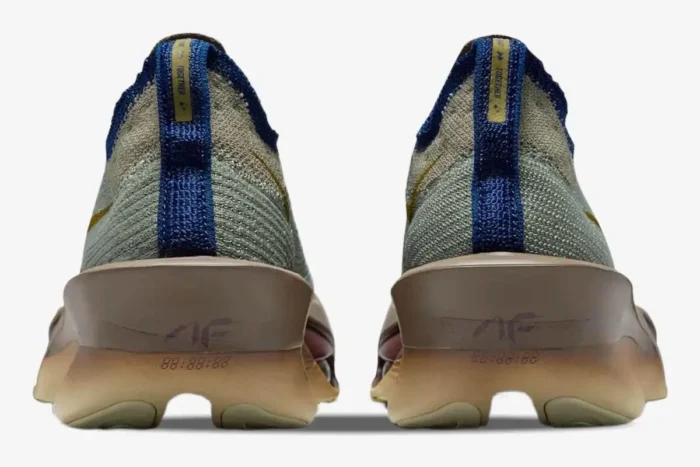 Rear view of Nike Air Zoom Alphafly 3 Premium running shoes in grey, gold, and brown. - SKU HV4318-320
