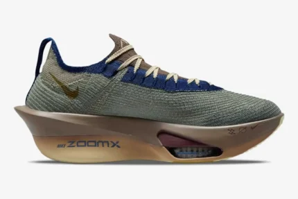 Side profile of Nike Air Zoom Alphafly 3 Premium running shoe in grey, gold, and brown. - SKU HV4318-320