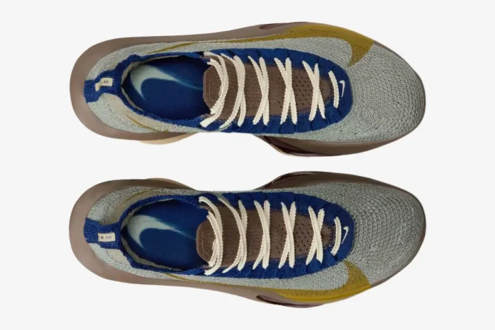 Top-down view of Nike Air Zoom Alphafly 3 Premium running shoes in grey, gold, and brown. - SKU HV4318-320