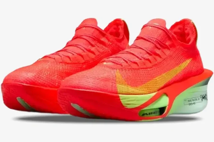 Nike Air Zoom Alphafly Next% 3 running shoes in orange, red, and green, front three-quarter view. - SKU FD8311-600