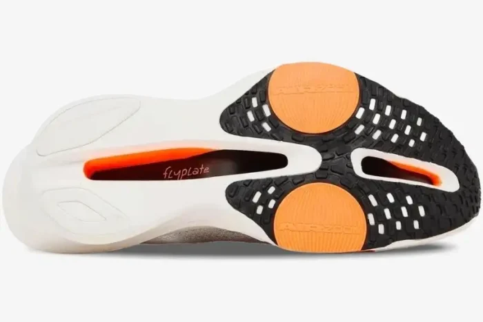 Bottom view of Nike Air Zoom Alphafly Next% 3 running shoe outsole in white and orange with flyplate detail. - SKU HF7357-100