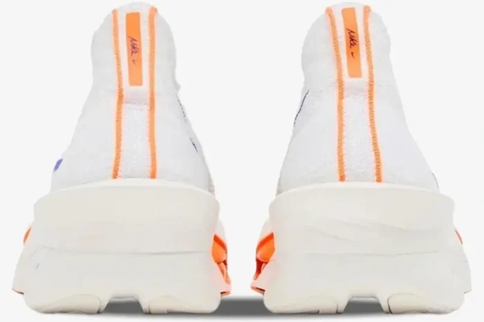 Rear view of Nike Air Zoom Alphafly Next% 3 running shoes in white with orange heel stripes. - SKU HF7357-100