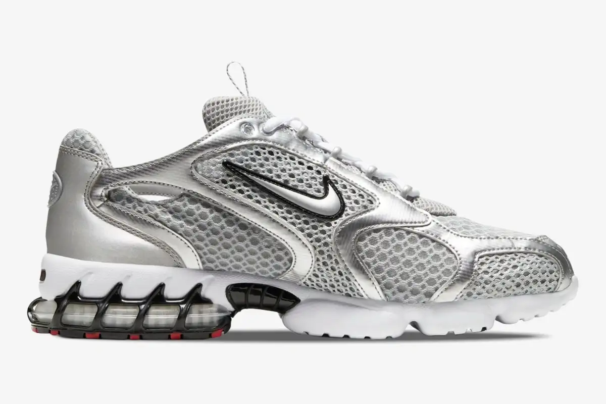 nike-air-zoom-spiridon-cage-2-silver-side-cj1288-001 Side profile of Nike Air Zoom Spiridon Cage 2 Metallic Silver sneaker with mesh upper and caged heel. - SKU CJ1288-001
