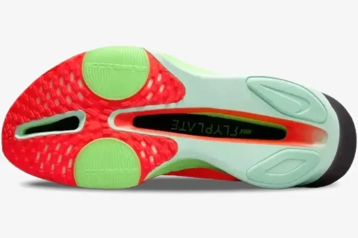 Sole view of Nike Air Zoom Alphafly Next% 3 in orange, red, and green with Flyplate visible. - SKU FD8311-600