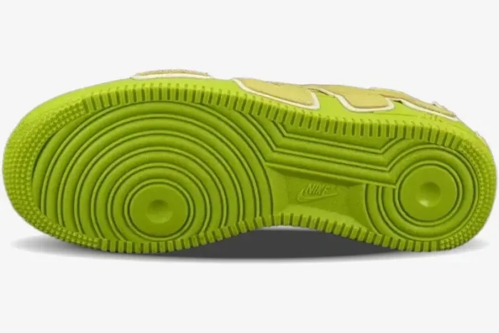 Bottom view of the lime green outsole of a Cactus Plant Flea Market x Nike Air Force 1 sneaker. - SKU FN0255-300