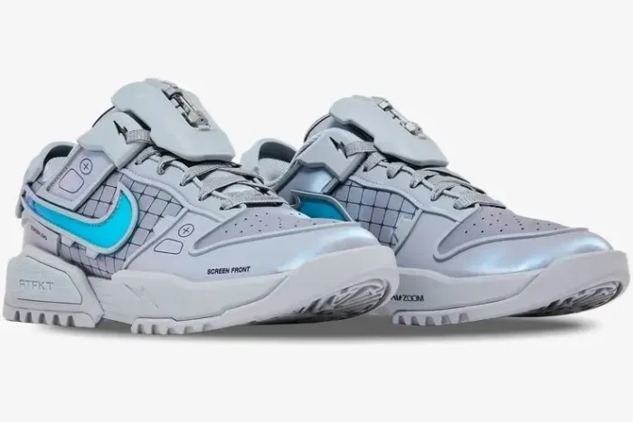 Nike Dunk Genesis x RTFKT Void Limited Edition sneakers in silver and blue, three-quarter side view. - SKU HF0438-001