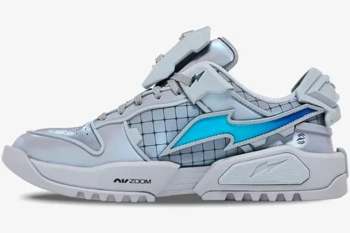 Side profile of a Nike Dunk Genesis x RTFKT Void sneaker in iridescent silver with a blue lightning bolt swoosh. - SKU HF0438-001