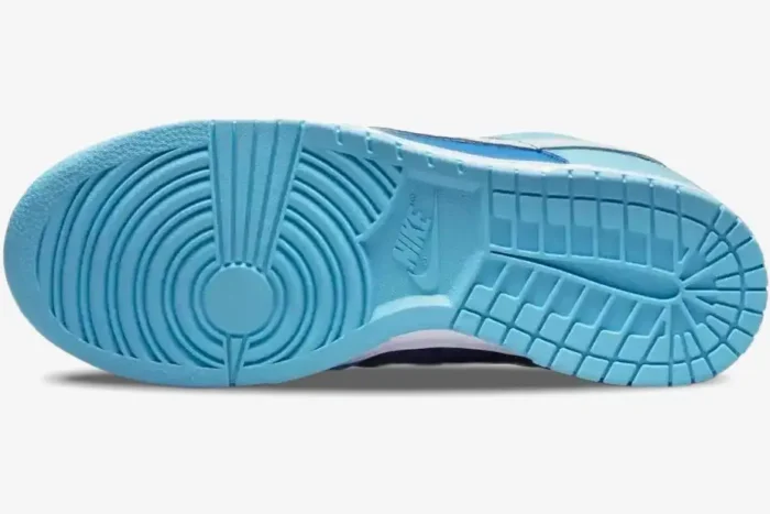 Bottom view of the light blue outsole of a Nike Dunk Low Argon CO.JP Retro sneaker. - SKU DM0121-400