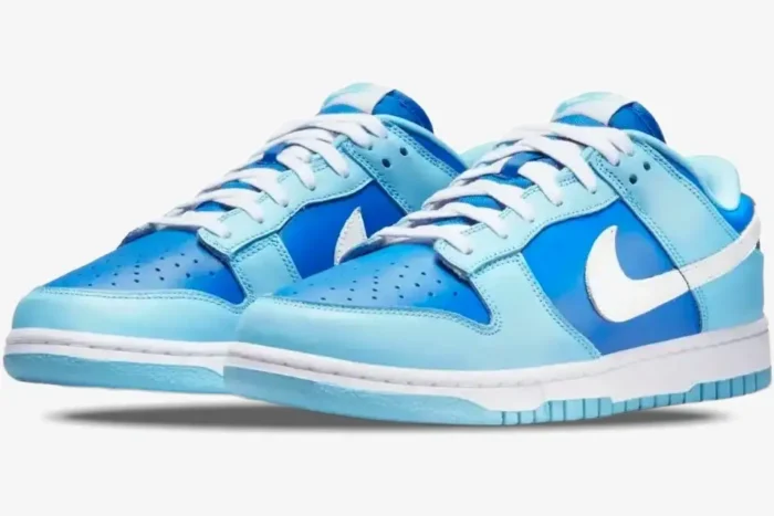 Nike Dunk Low Argon CO.JP Retro sneakers in light and dark blue with white swoosh, three-quarter front view. - SKU DM0121-400